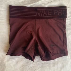 Dark red Nike pro shorts
